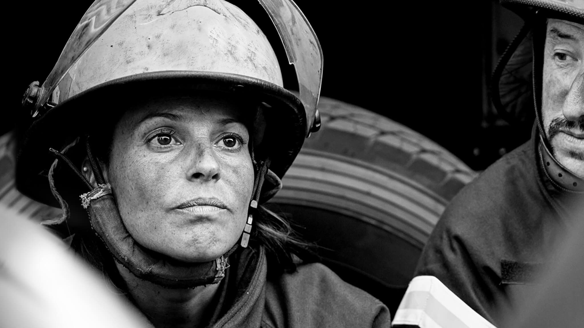 A firefighter talks to a group